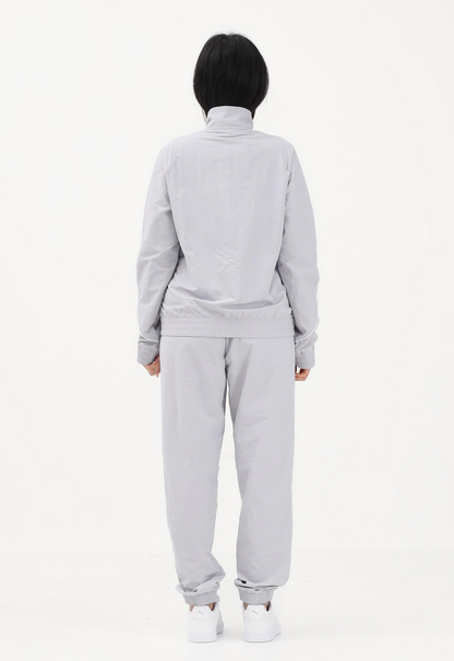 PUMA Tuta Woven grigia da donna